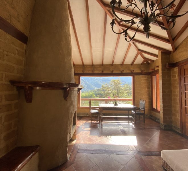 Gorgeous home made of adobe, river rock, and wood, located at the gated community called El Atillo in Vilcabamba
